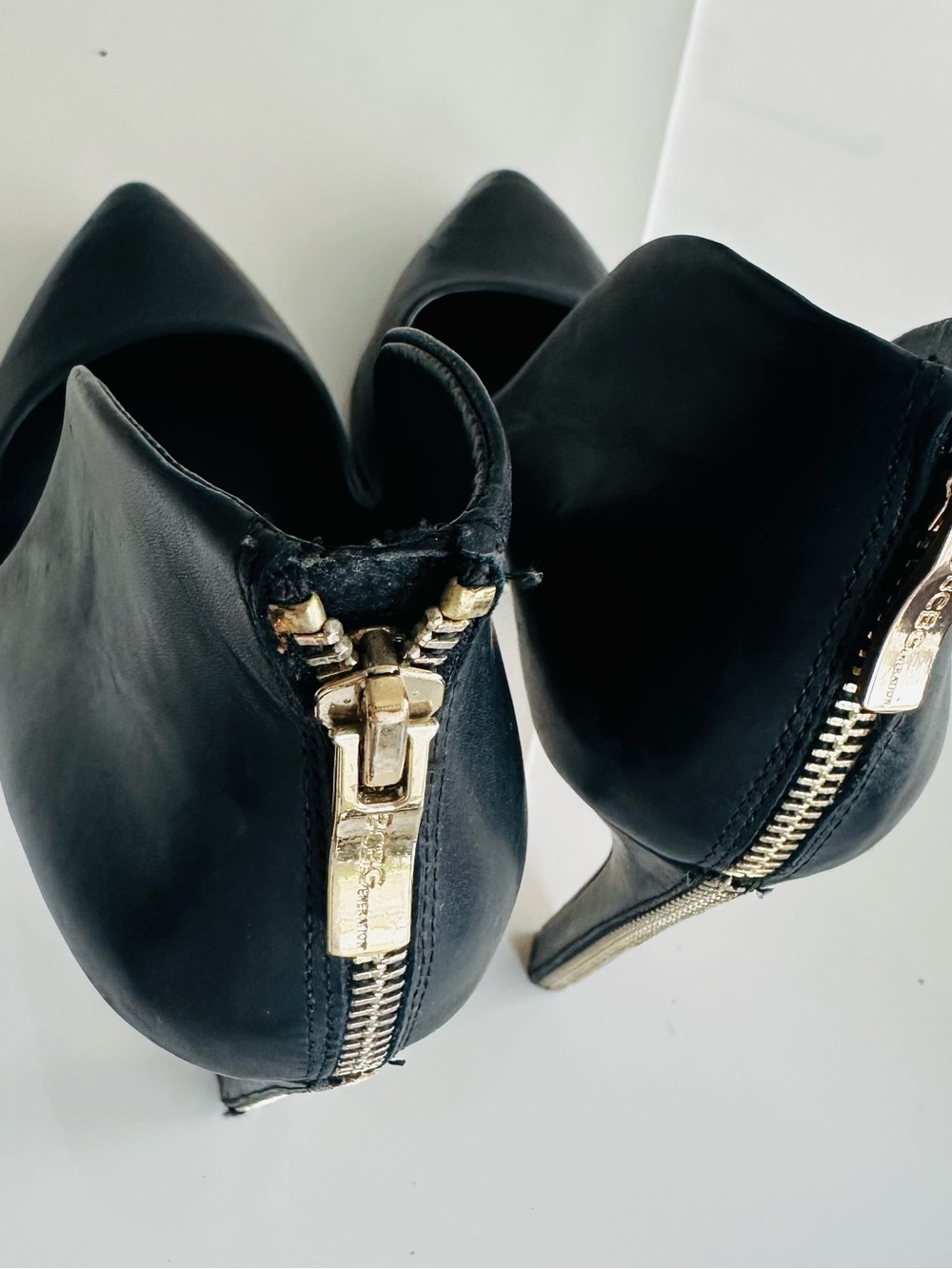 BCBG Black Leather Pointed-Toe Women's Ankle Heels with Gold Zipper